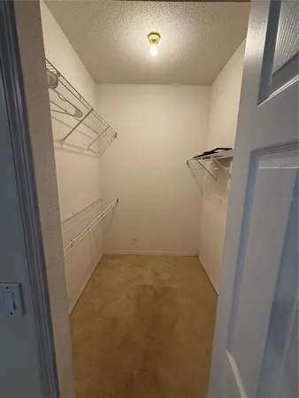 a bathroom with a tub a sink and a mirror