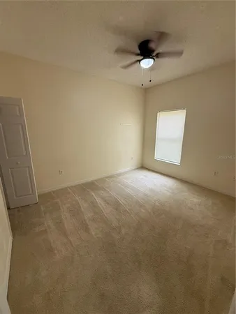 view of room with stairs and wooden floor