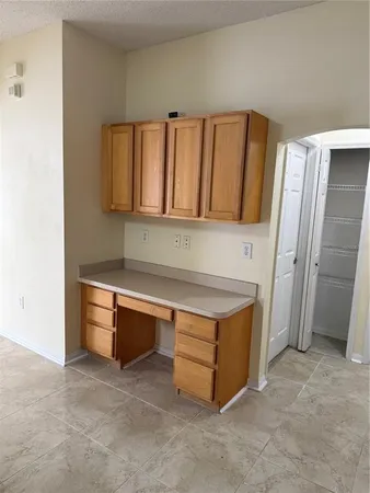 a kitchen with stainless steel appliances granite countertop a stove and a refrigerator