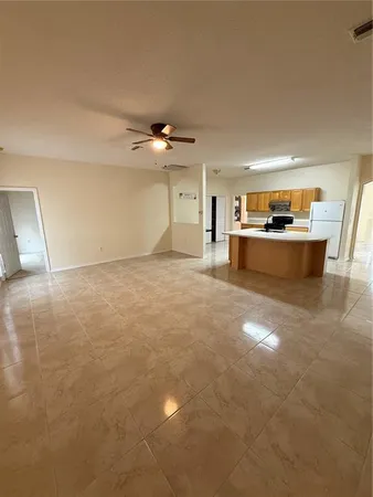 a view of kitchen and kitchen with sink