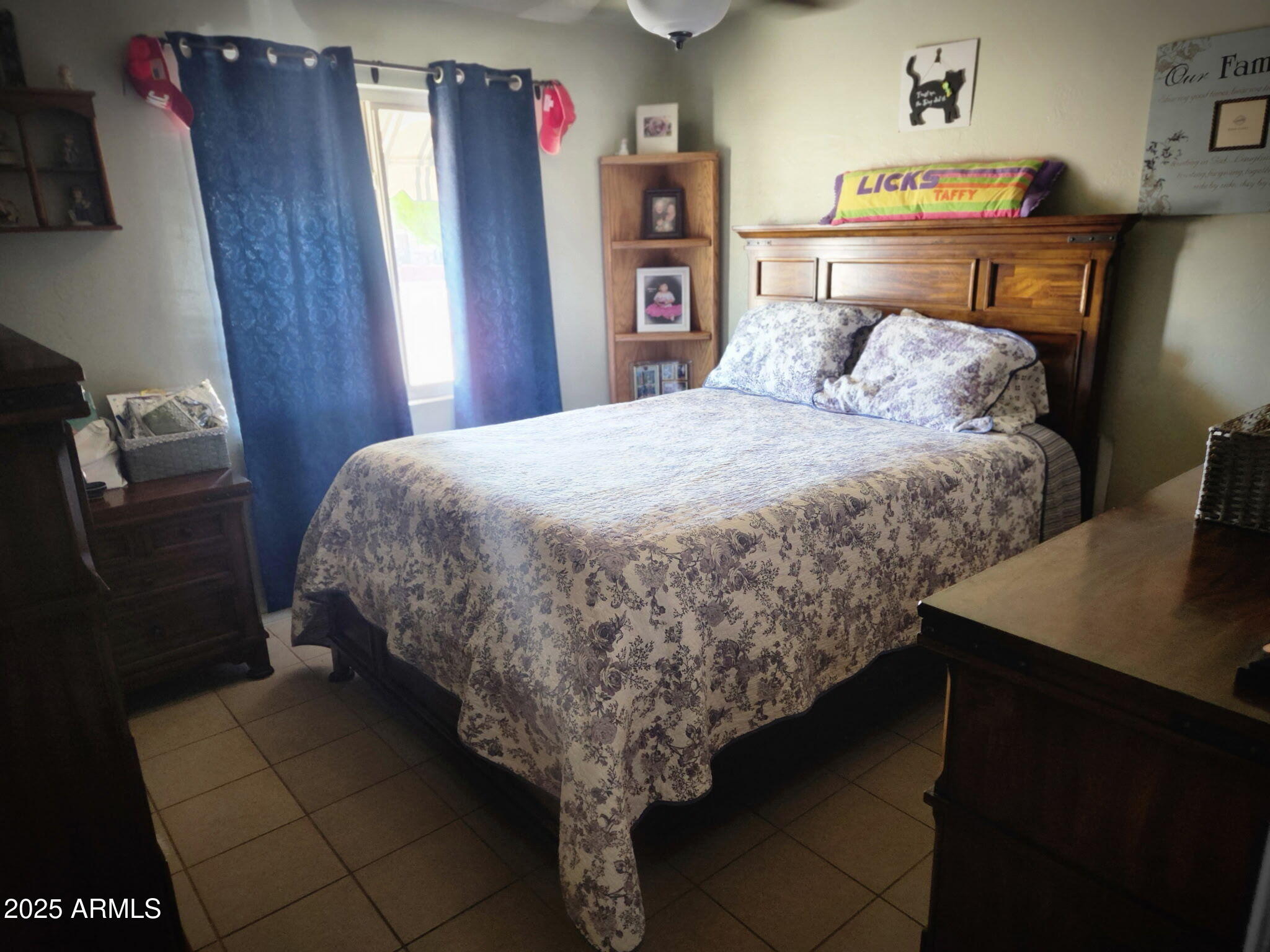 3039 East Cactus Road Phoenix, AZ 85028 - Photo 11 of 15 a bedroom with a bed and a desk
