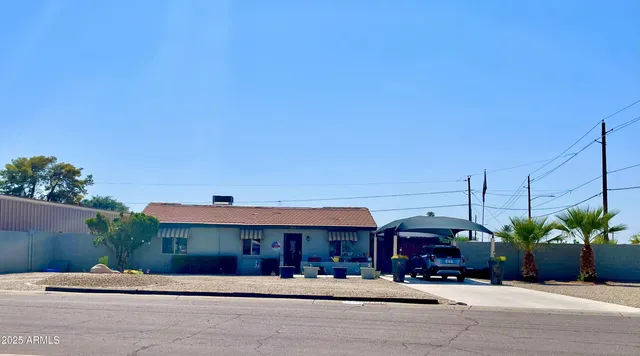 a front view of a building with tree s