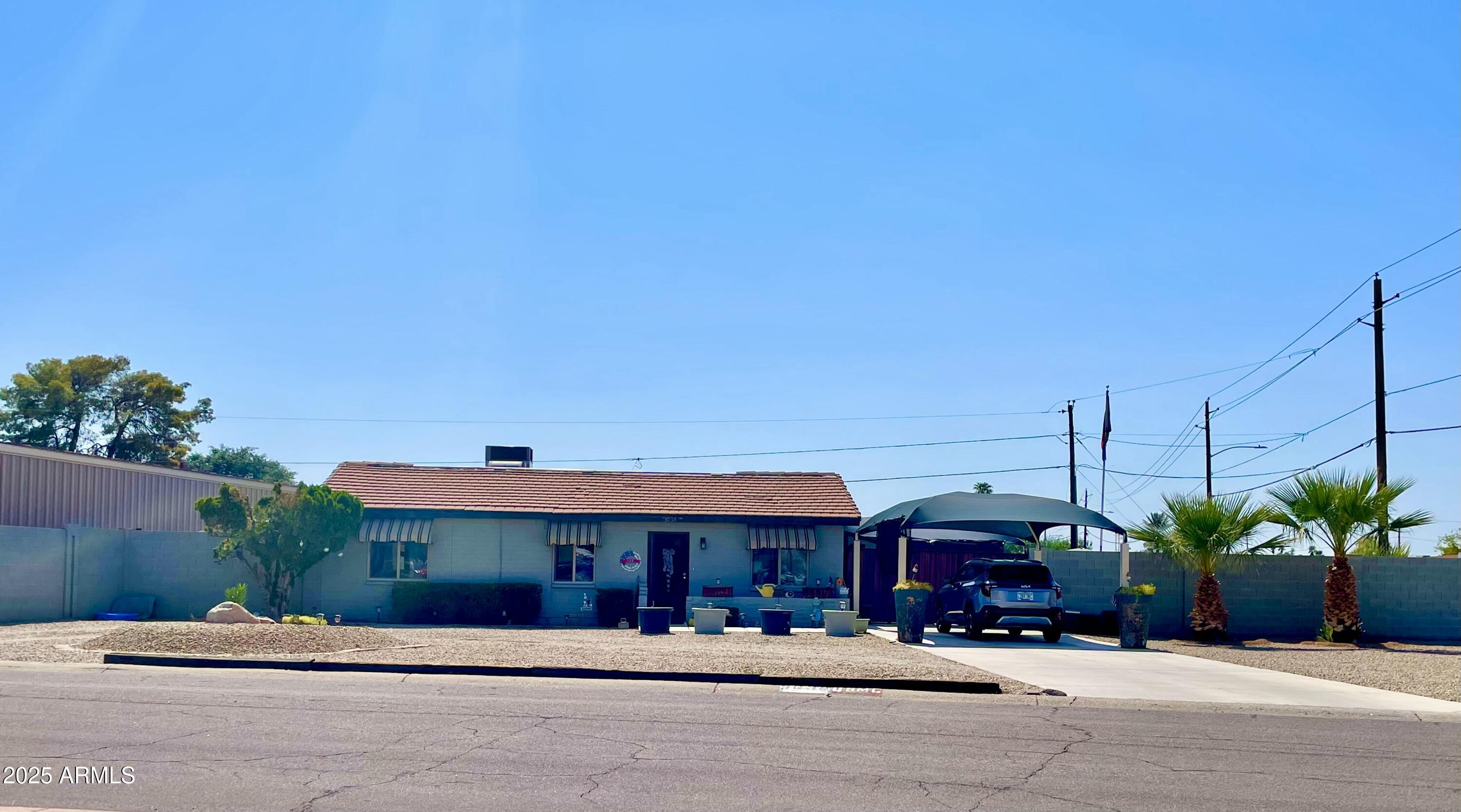 3039 East Cactus Road Phoenix, AZ 85028 - Photo 2 of 15 a front view of a building with tree s
