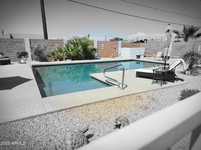 a view of a living room with a sink and couch