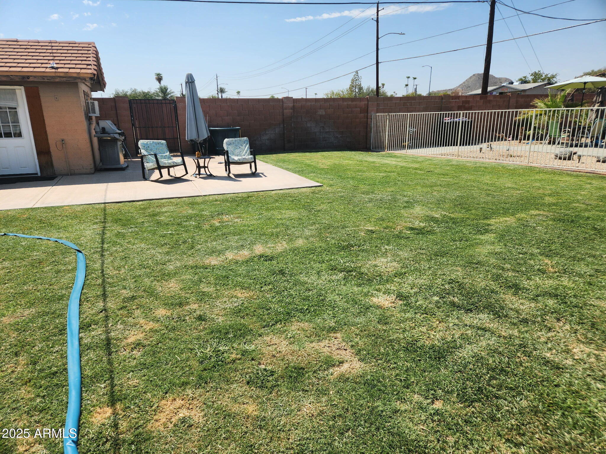 3039 East Cactus Road Phoenix, AZ 85028 - Photo 5 of 15 a view of a backyard with seating area
