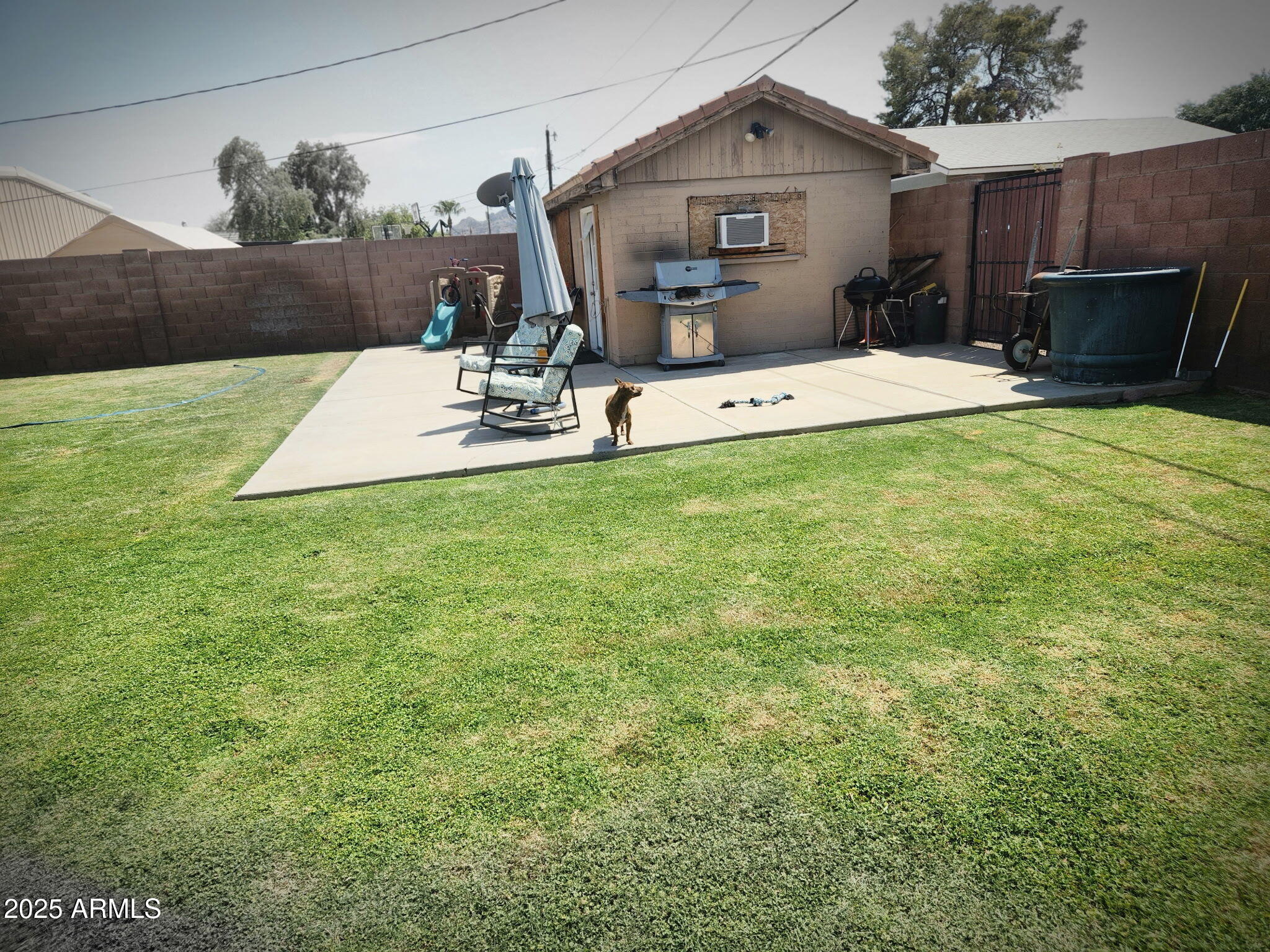 3039 East Cactus Road Phoenix, AZ 85028 - Photo 6 of 15 a view of a house with backyard and sitting area