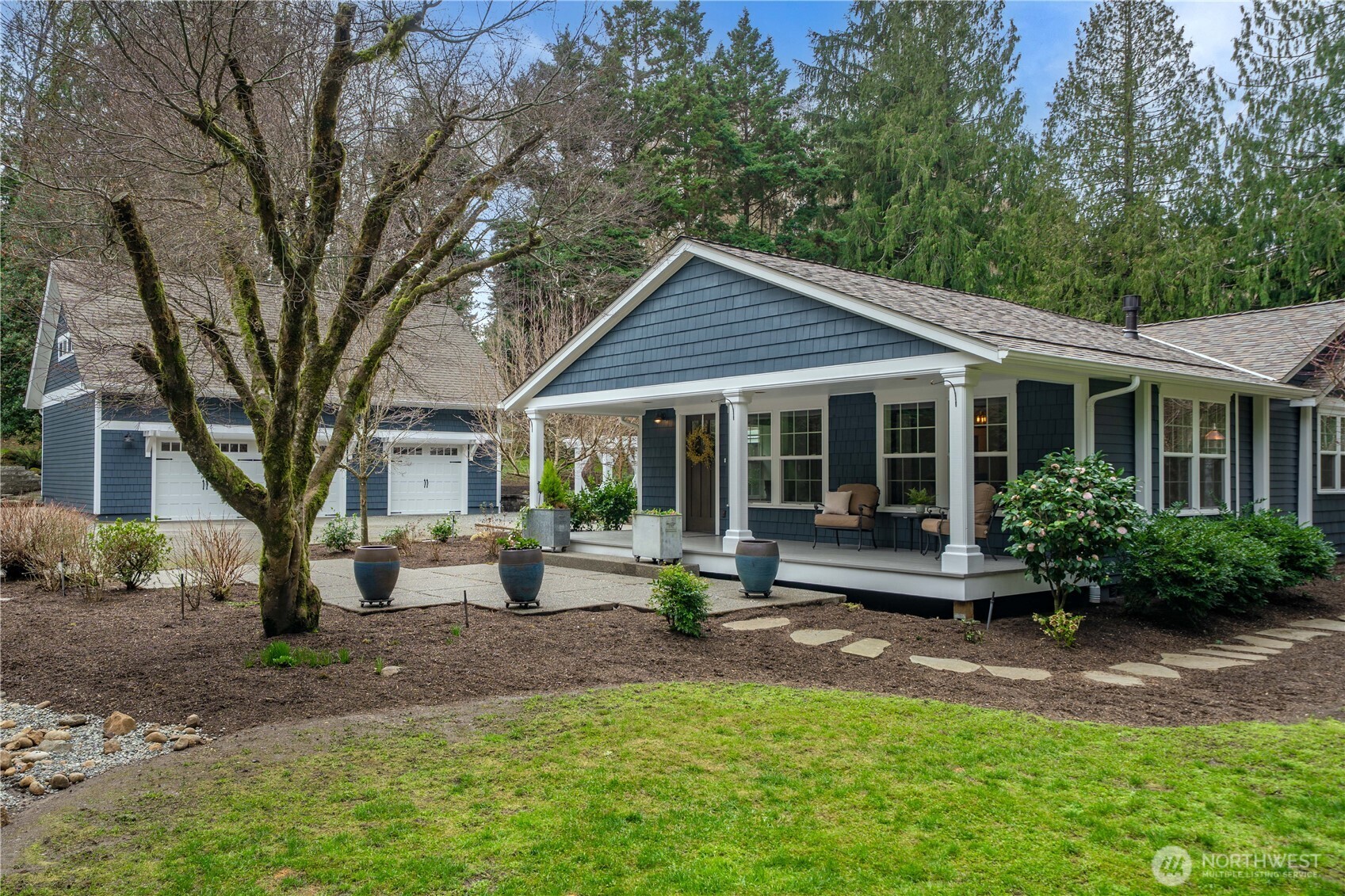 26002 Southeast 208th Street Maple Valley, WA 98038 - Photo 2 of 40 a view of a house with backyard sitting area and garden