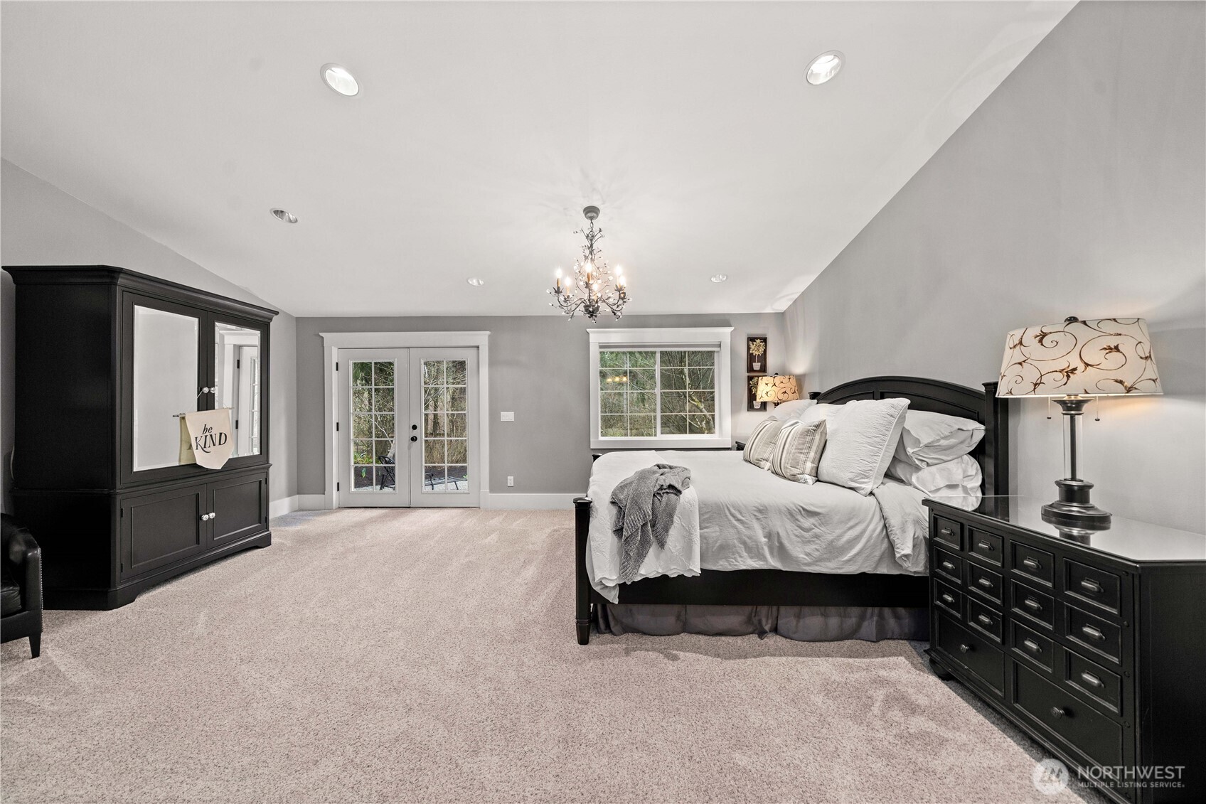 26002 Southeast 208th Street Maple Valley, WA 98038 - Photo 21 of 40 a spacious bedroom with a bed and a flat screen television