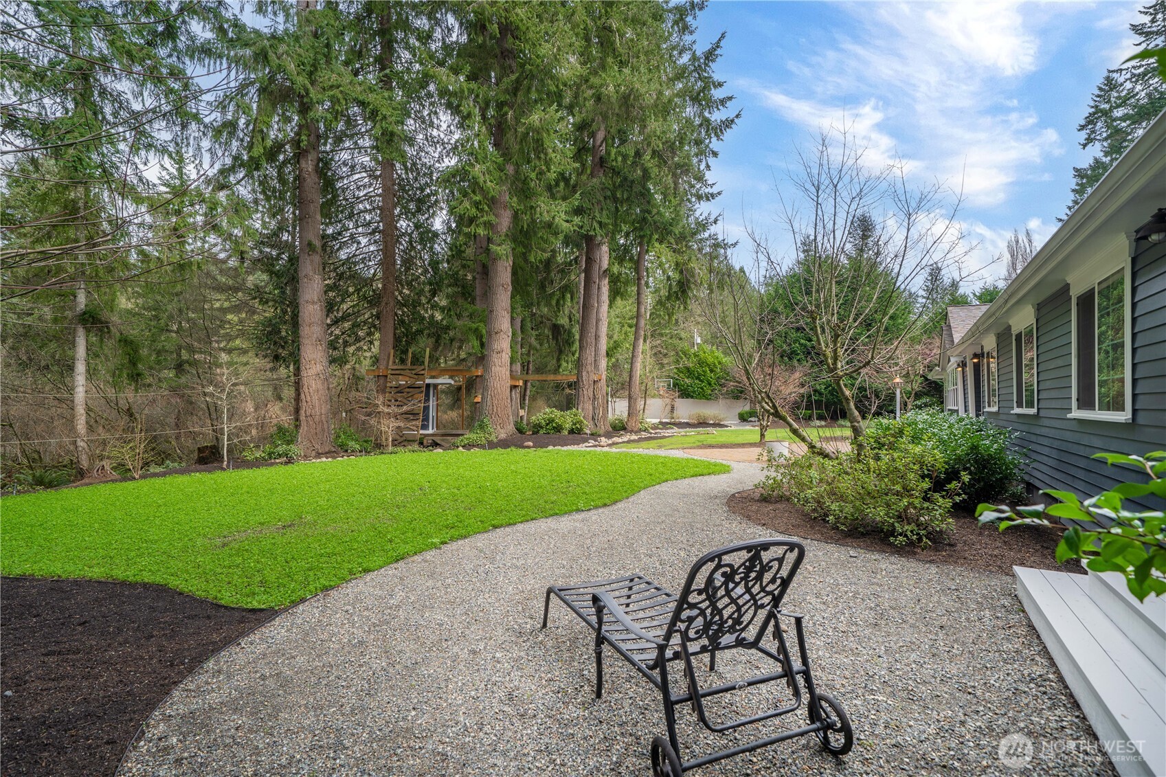 26002 Southeast 208th Street Maple Valley, WA 98038 - Photo 22 of 40 a swimming pool with outdoor seating and garden