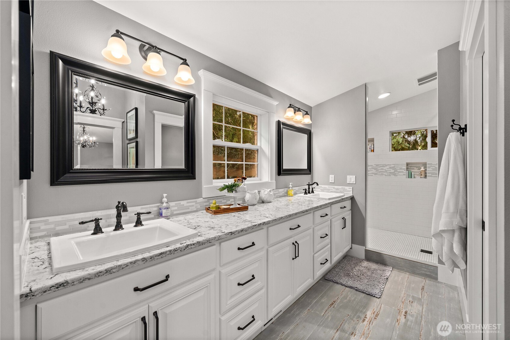 26002 Southeast 208th Street Maple Valley, WA 98038 - Photo 23 of 40 a bathroom with double vanity sink and a mirror