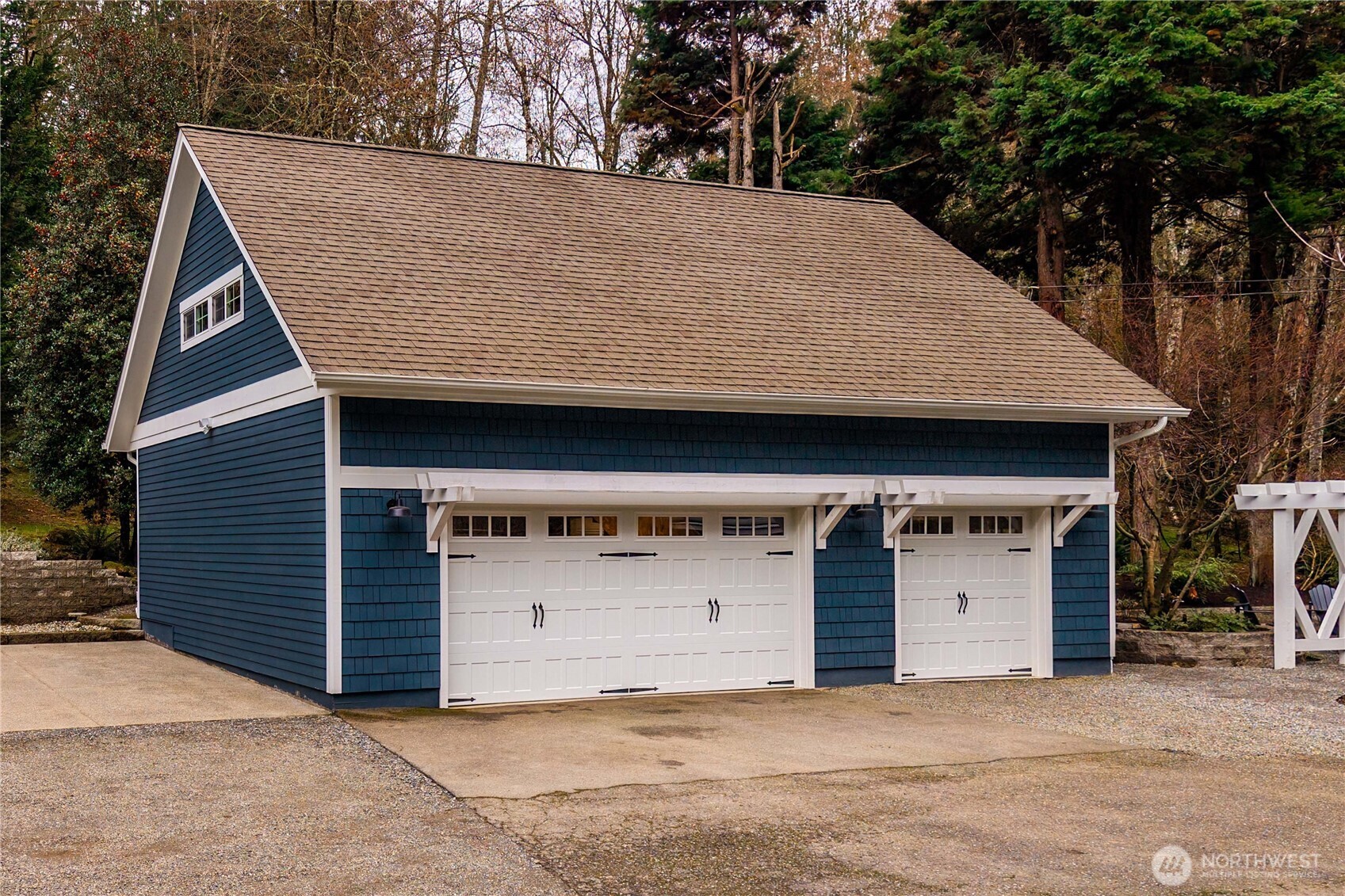 26002 Southeast 208th Street Maple Valley, WA 98038 - Photo 31 of 40 a front view of a house with garage