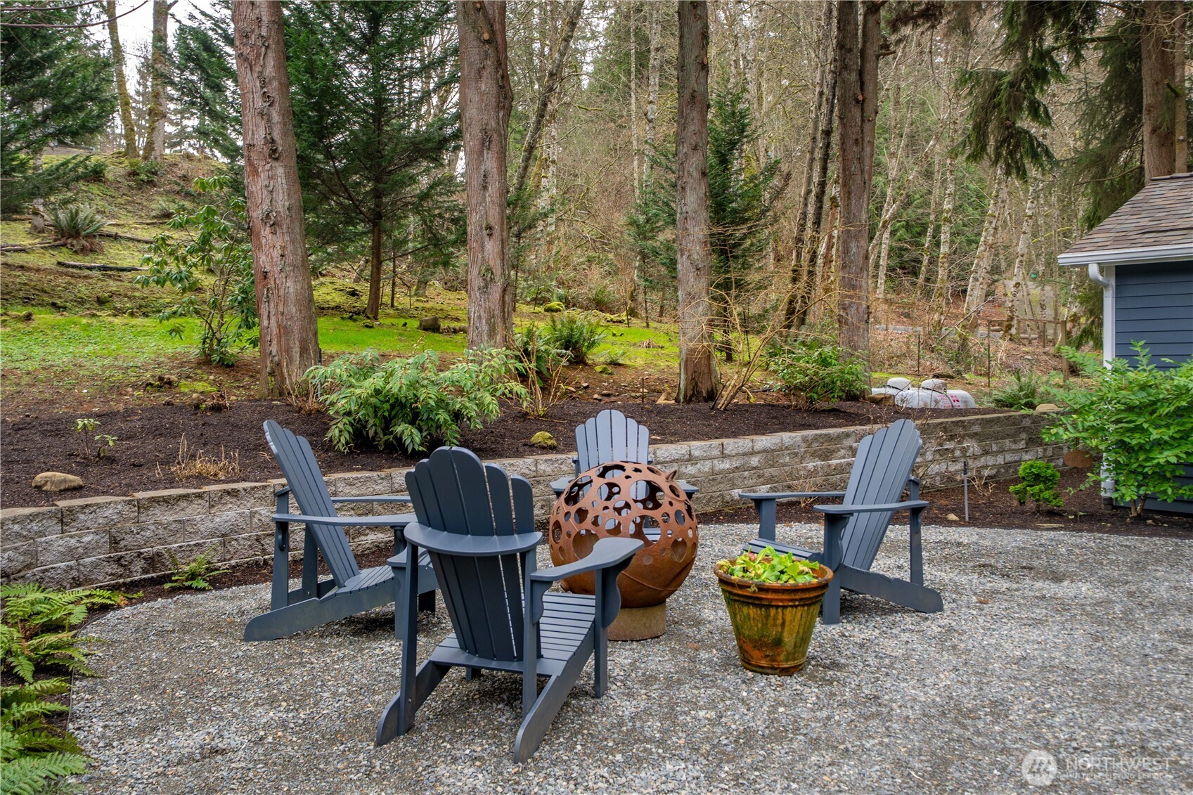 26002 Southeast 208th Street Maple Valley, WA 98038 - Photo 34 of 40 a view of a patio with table and chairs potted plants and large tree