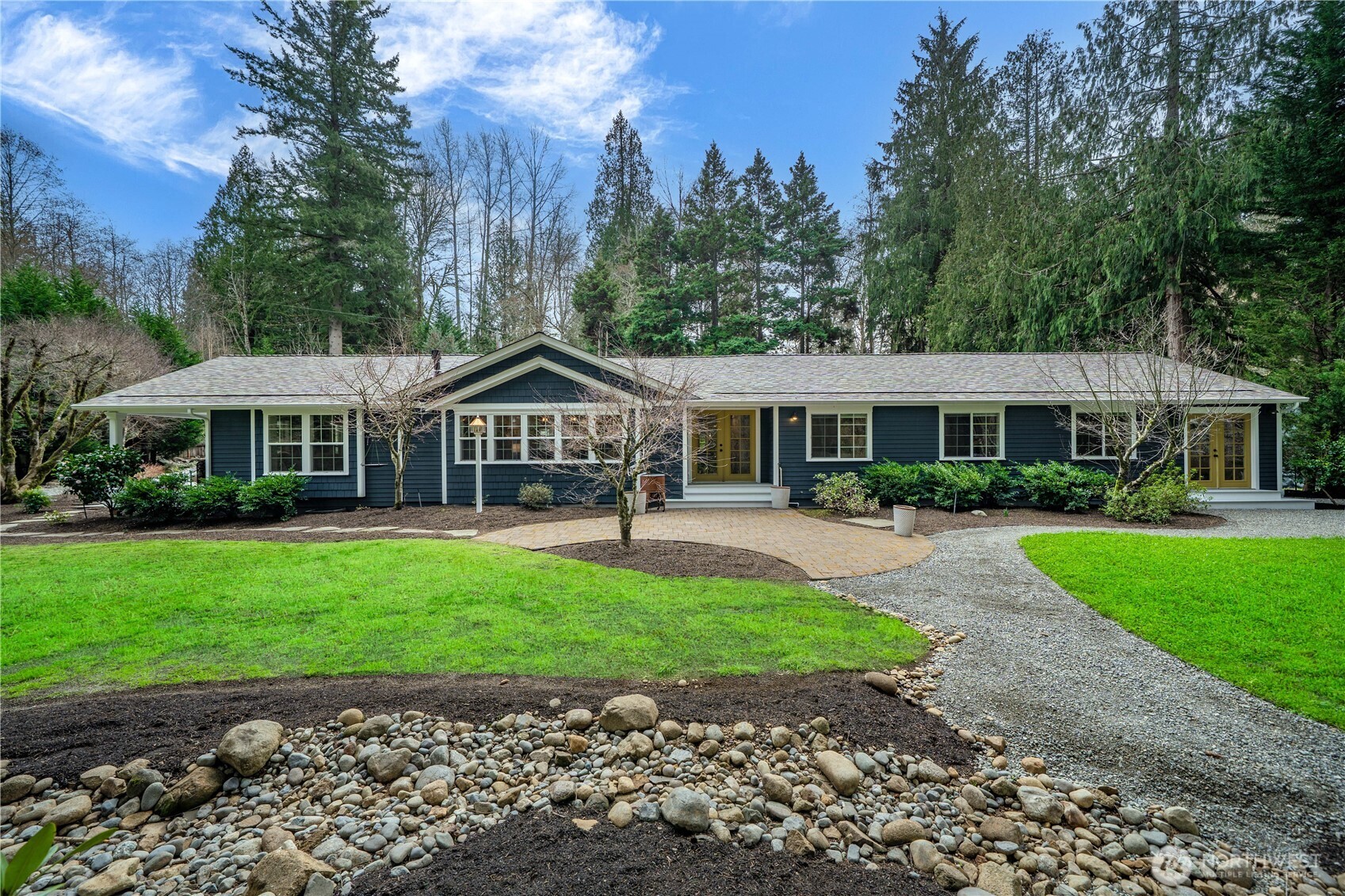 26002 Southeast 208th Street Maple Valley, WA 98038 - Photo 38 of 40 a front view of a house with a garden
