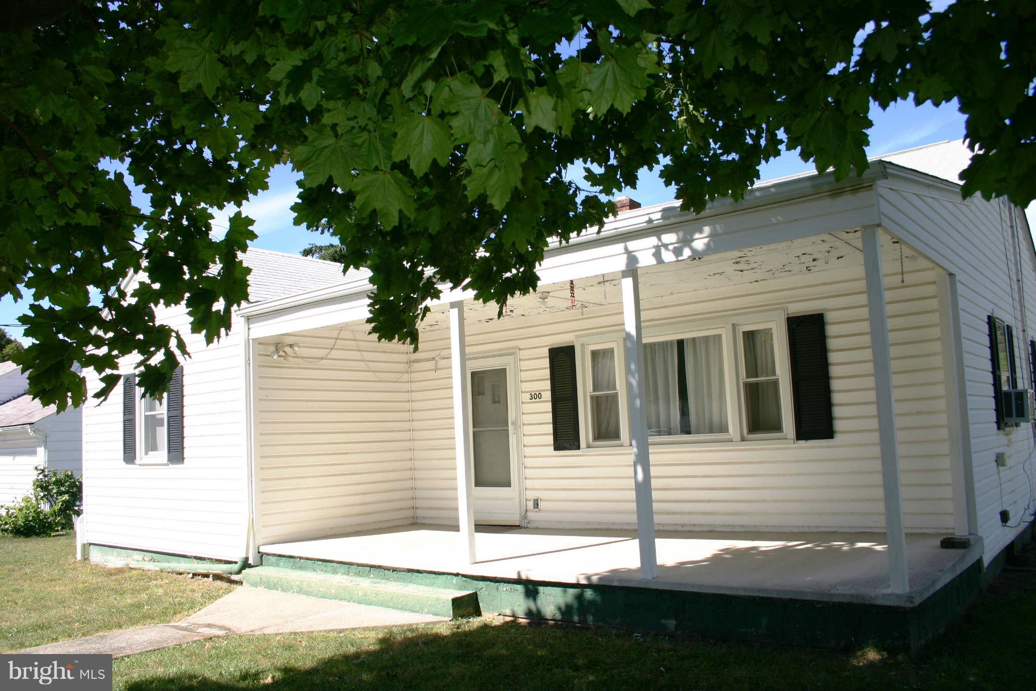 300 West 6th Avenue Ranson, WV 25438 - Photo 2 of 11 a view of a white house with a tree