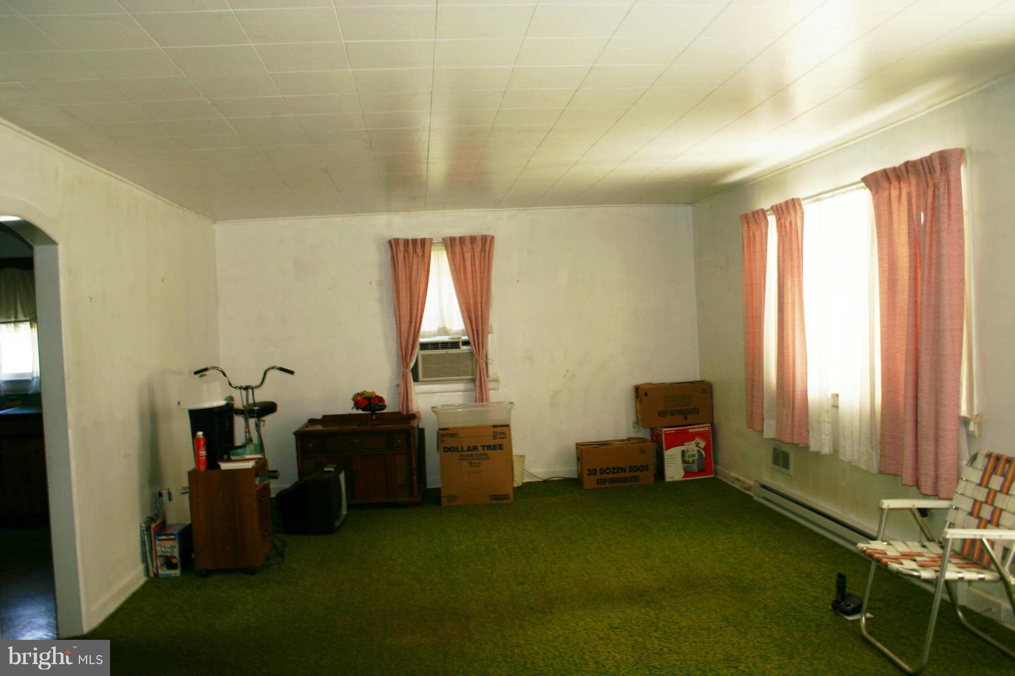 300 West 6th Avenue Ranson, WV 25438 - Photo 3 of 11 a room with furniture and a window
