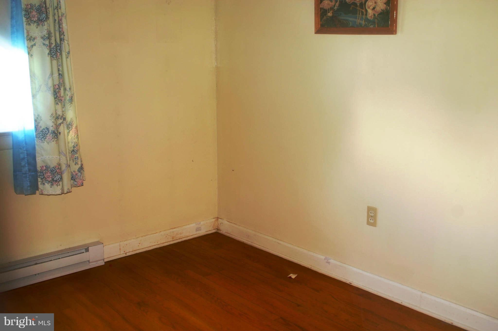 300 West 6th Avenue Ranson, WV 25438 - Photo 6 of 11 a view of a small space with wooden floor and a window
