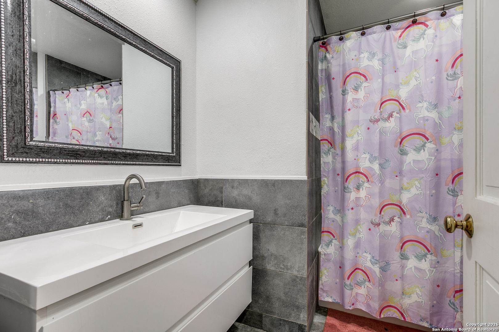 825 Garraty Road Terrell Hills, TX 78209 - Photo 20 of 25 a bathroom with a sink and a mirror