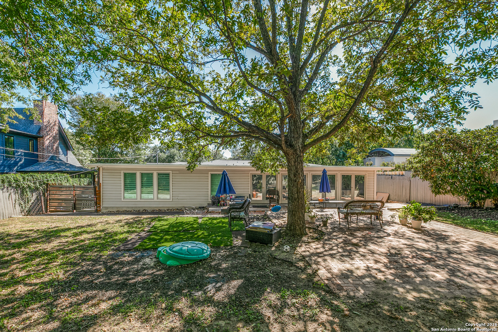 825 Garraty Road Terrell Hills, TX 78209 - Photo 24 of 25 a backyard of a house with yard and barbeque oven