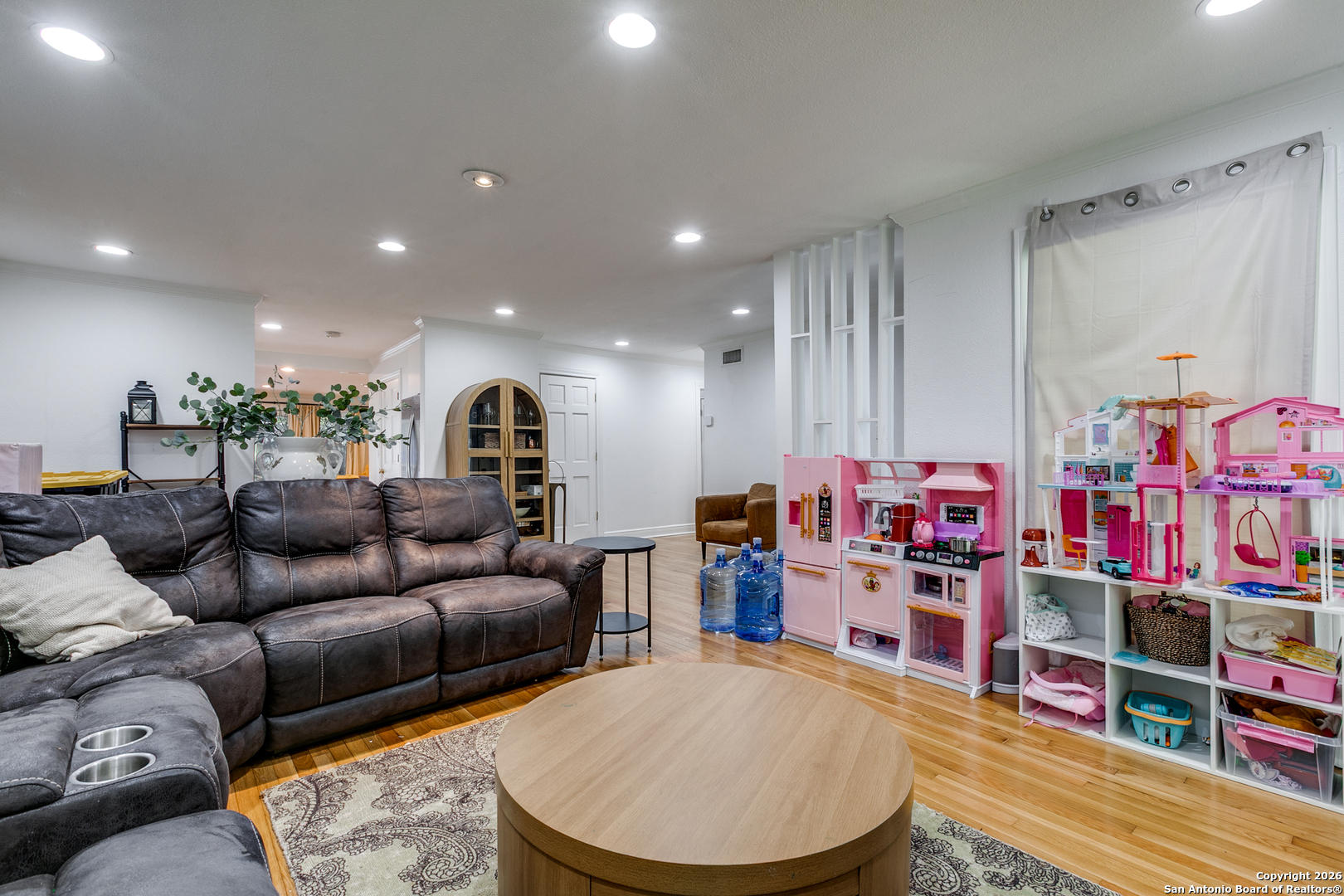 825 Garraty Road Terrell Hills, TX 78209 - Photo 8 of 25 a living room with lots of furniture and a wooden floor
