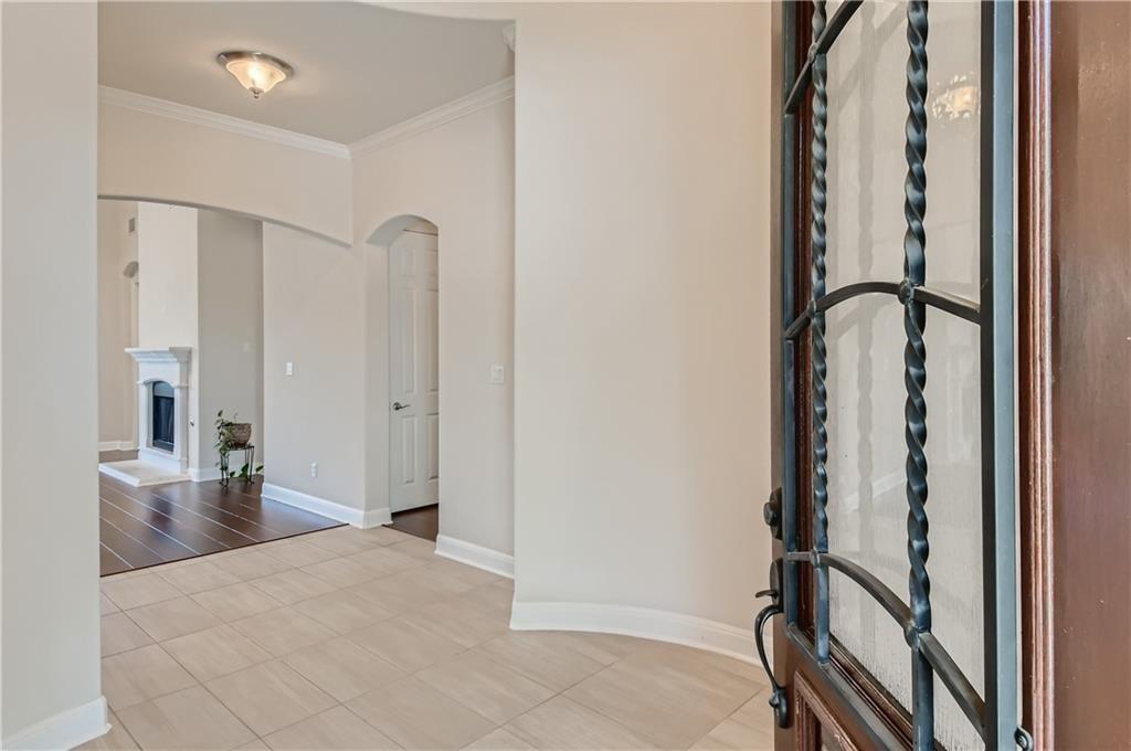 3822 Remington Road Cedar Park, TX 78613 - Photo 4 of 31 a view of front door with hallway and a bathroom