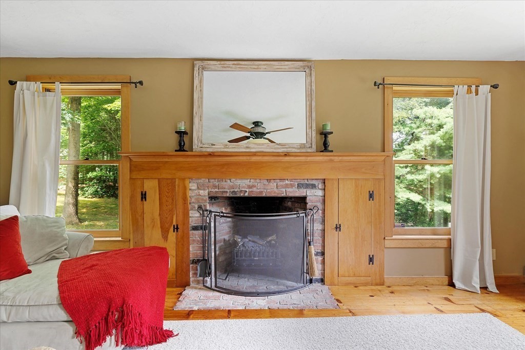 94 Stallion Hill Road Sturbridge, MA 01518 - Photo 17 of 42 a living room with furniture and a fireplace