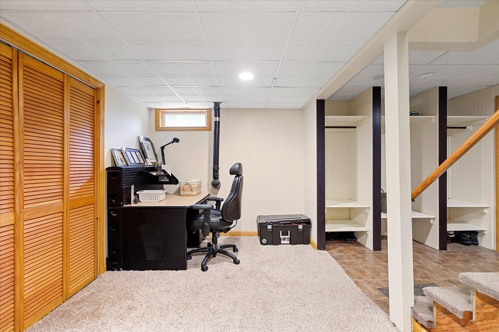 94 Stallion Hill Road Sturbridge, MA 01518 - Photo 32 of 42 a view of a workspace with furniture and a window