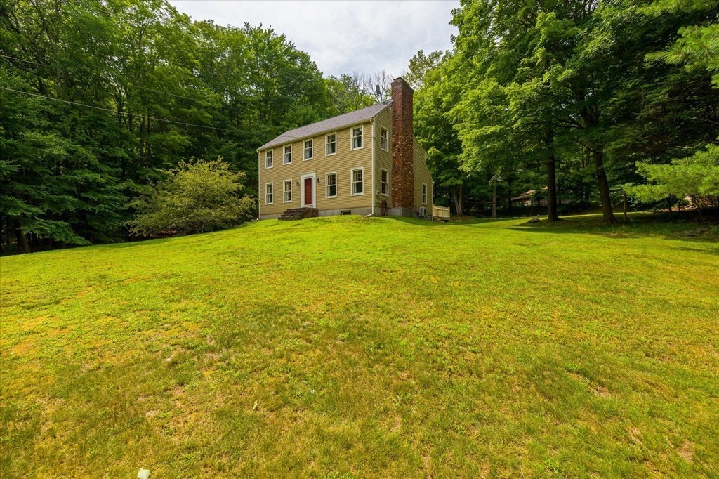 94 Stallion Hill Road Sturbridge, MA 01518 - Photo 36 of 42 a view of a house with a backyard space