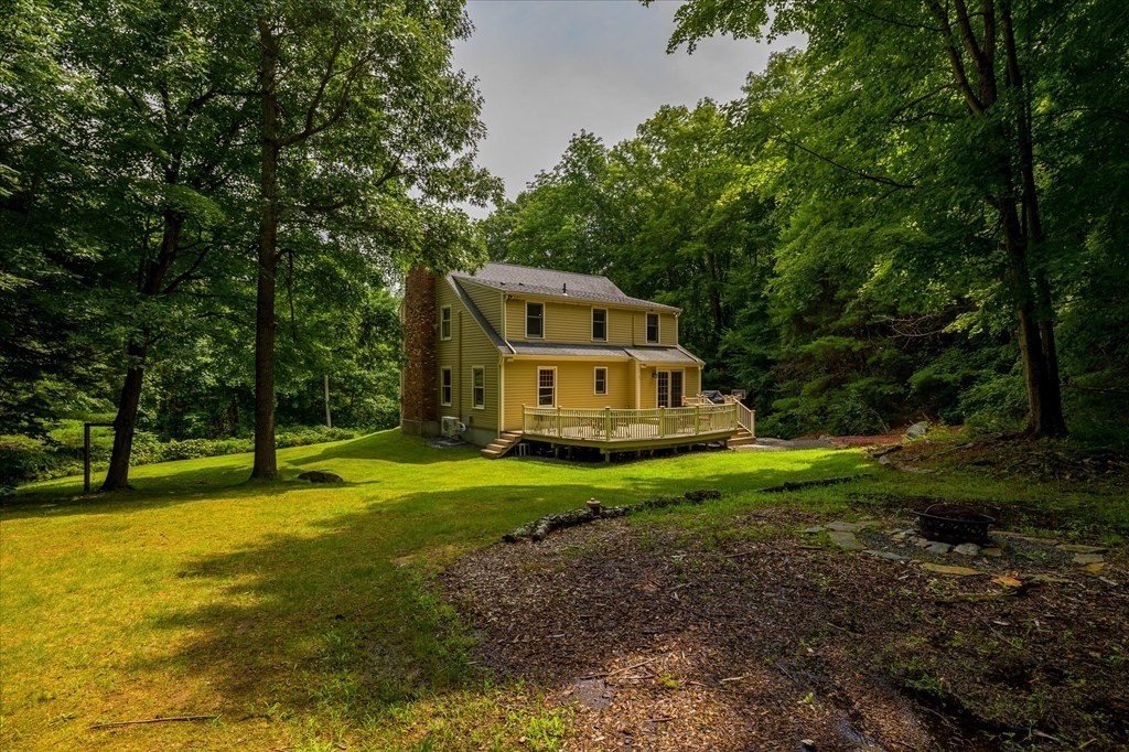 94 Stallion Hill Road Sturbridge, MA 01518 - Photo 6 of 42 a view of a house with a yard