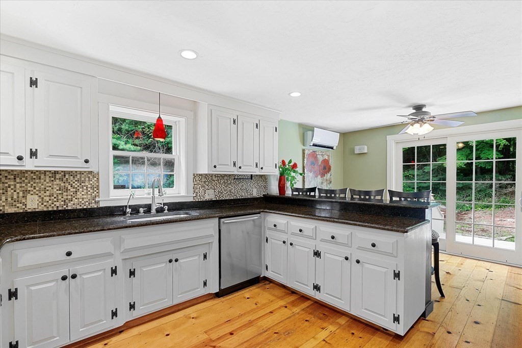 94 Stallion Hill Road Sturbridge, MA 01518 - Photo 10 of 42 a kitchen with granite countertop a sink and cabinets