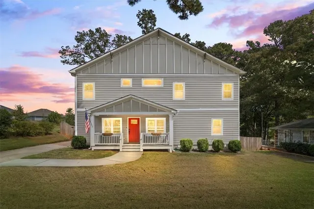 a front view of a house with a yard