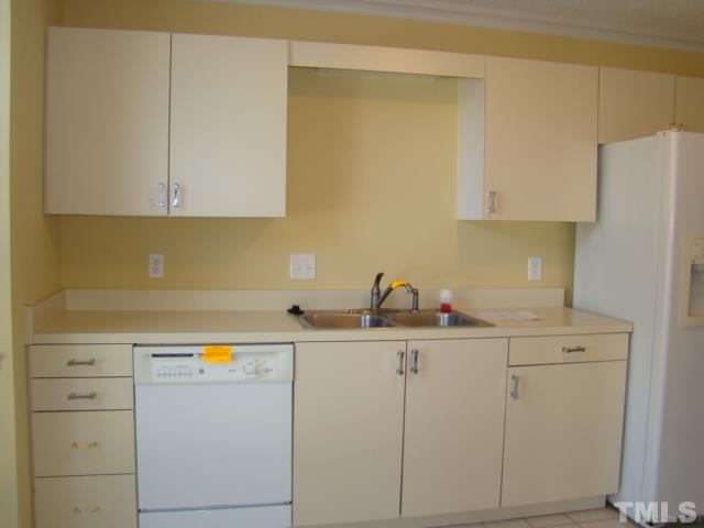 1425 Quarter Point Raleigh, NC 27615 - Photo 2 of 15 a utility room with cabinets washer and dryer