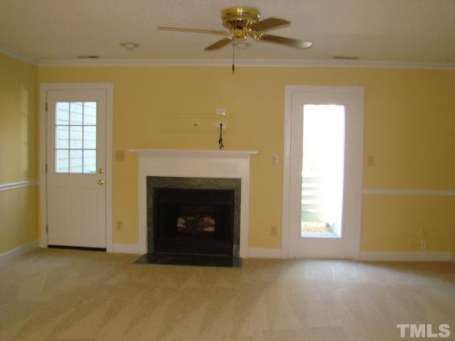 1425 Quarter Point Raleigh, NC 27615 - Photo 6 of 15 an empty room with windows and fireplace