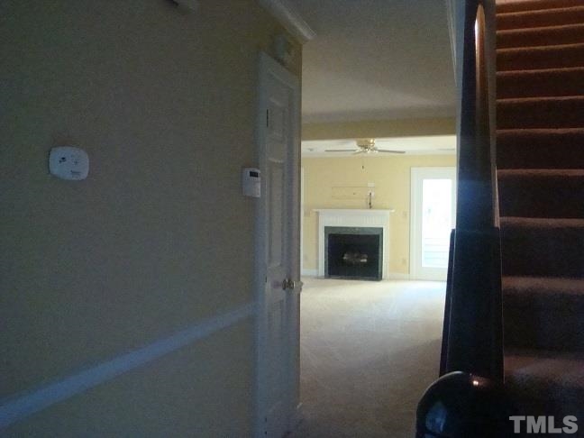 1425 Quarter Point Raleigh, NC 27615 - Photo 10 of 15 a view of an empty room with a fireplace and a window