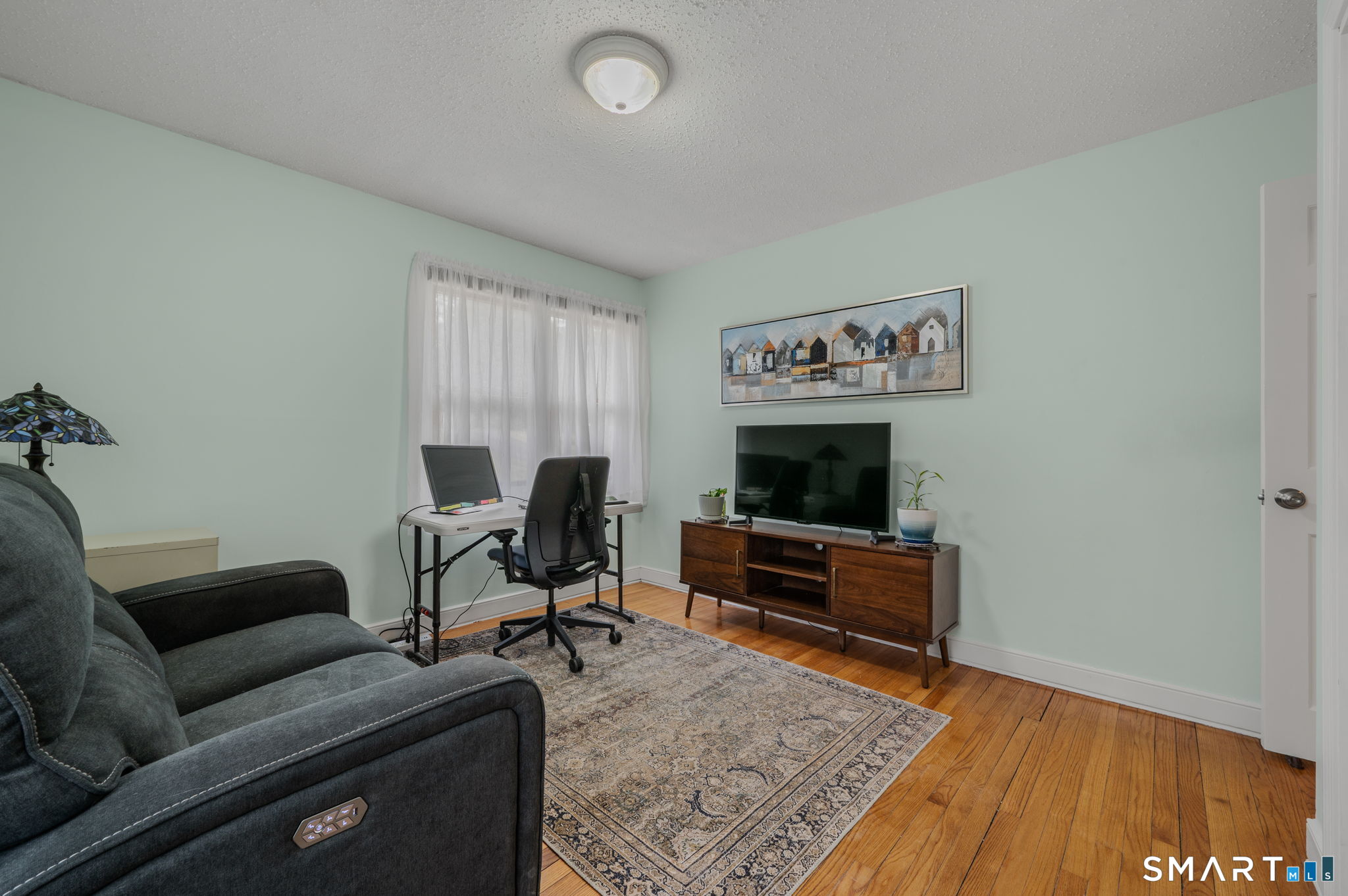 215 Haywardville Road East Haddam, CT 06415 - Photo 11 of 31 a living room with furniture and a flat screen tv