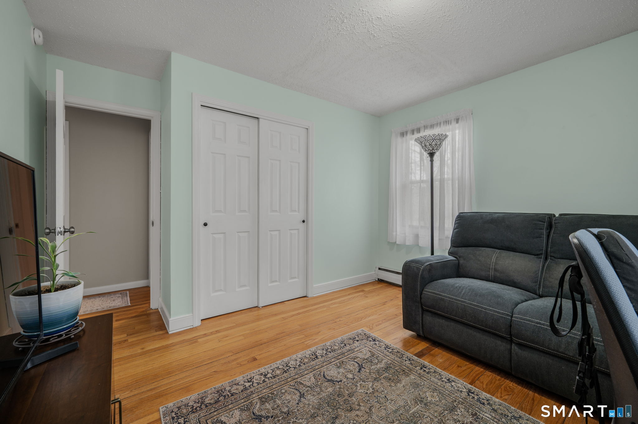215 Haywardville Road East Haddam, CT 06415 - Photo 12 of 31 a living room with furniture and a flat screen tv