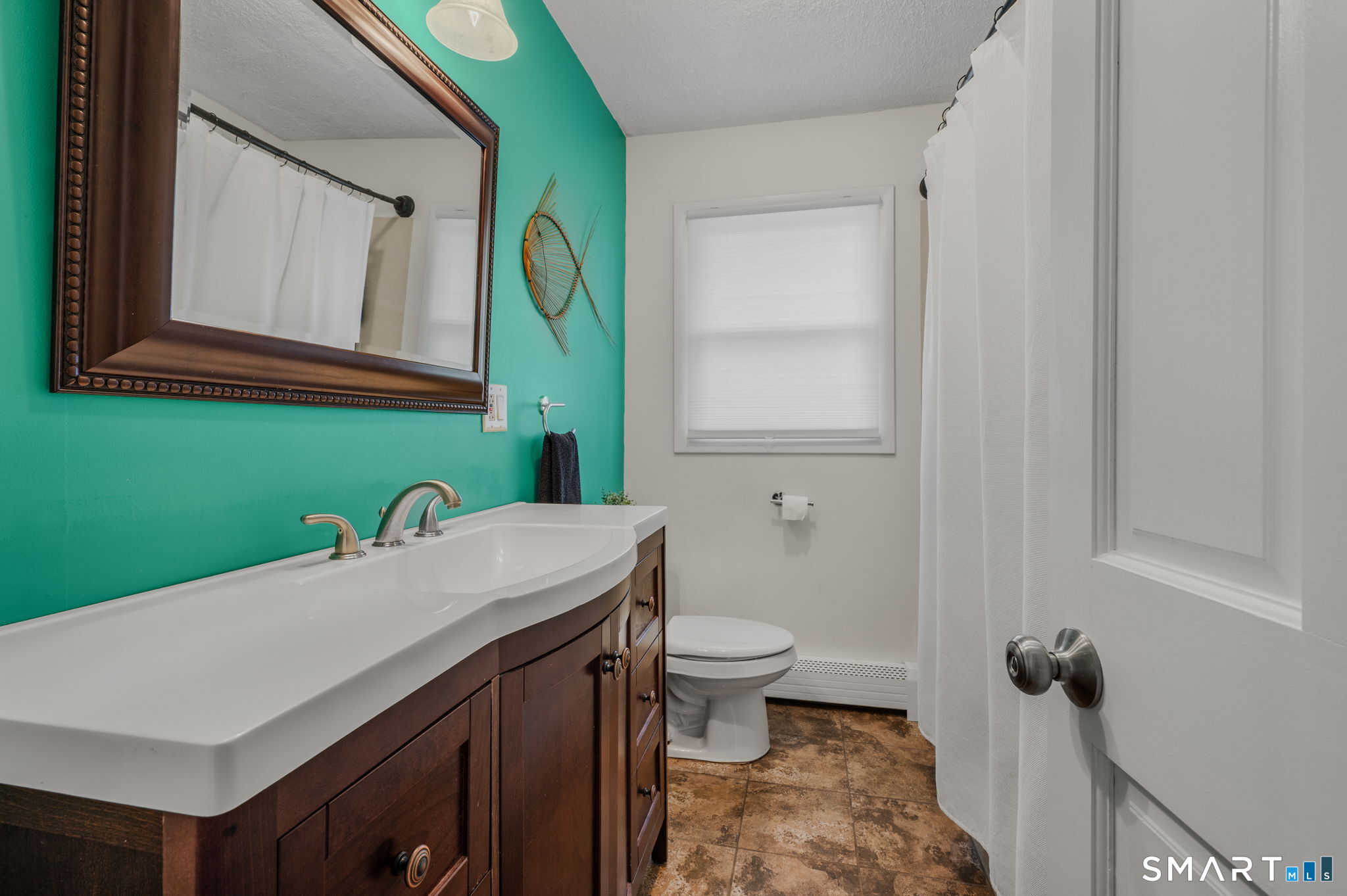 215 Haywardville Road East Haddam, CT 06415 - Photo 13 of 31 a bathroom with a sink a toilet and mirror
