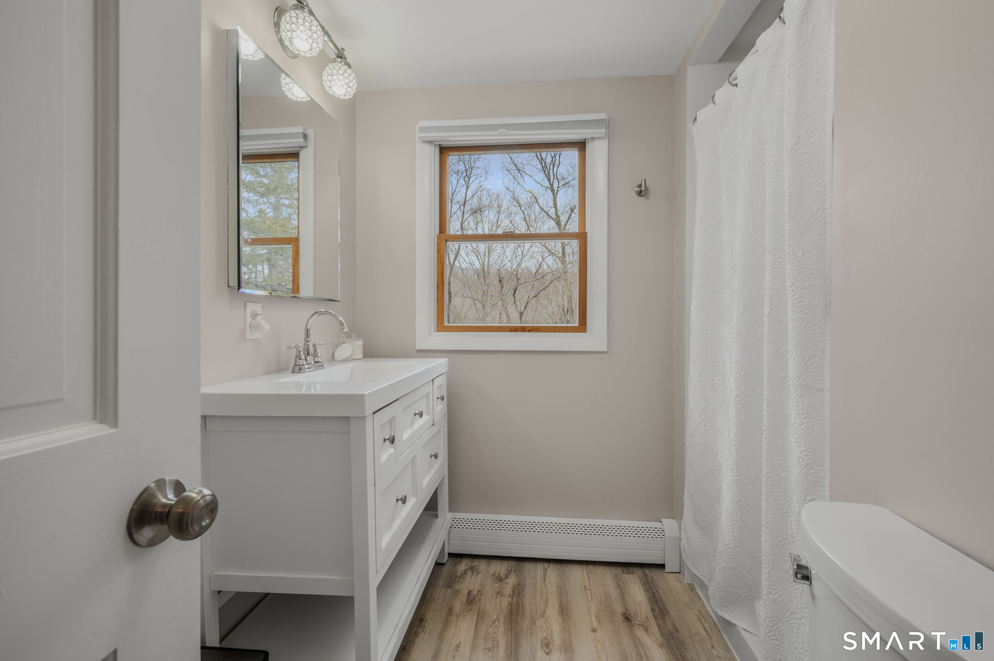 215 Haywardville Road East Haddam, CT 06415 - Photo 19 of 31 a bathroom with a sink mirror and toilet