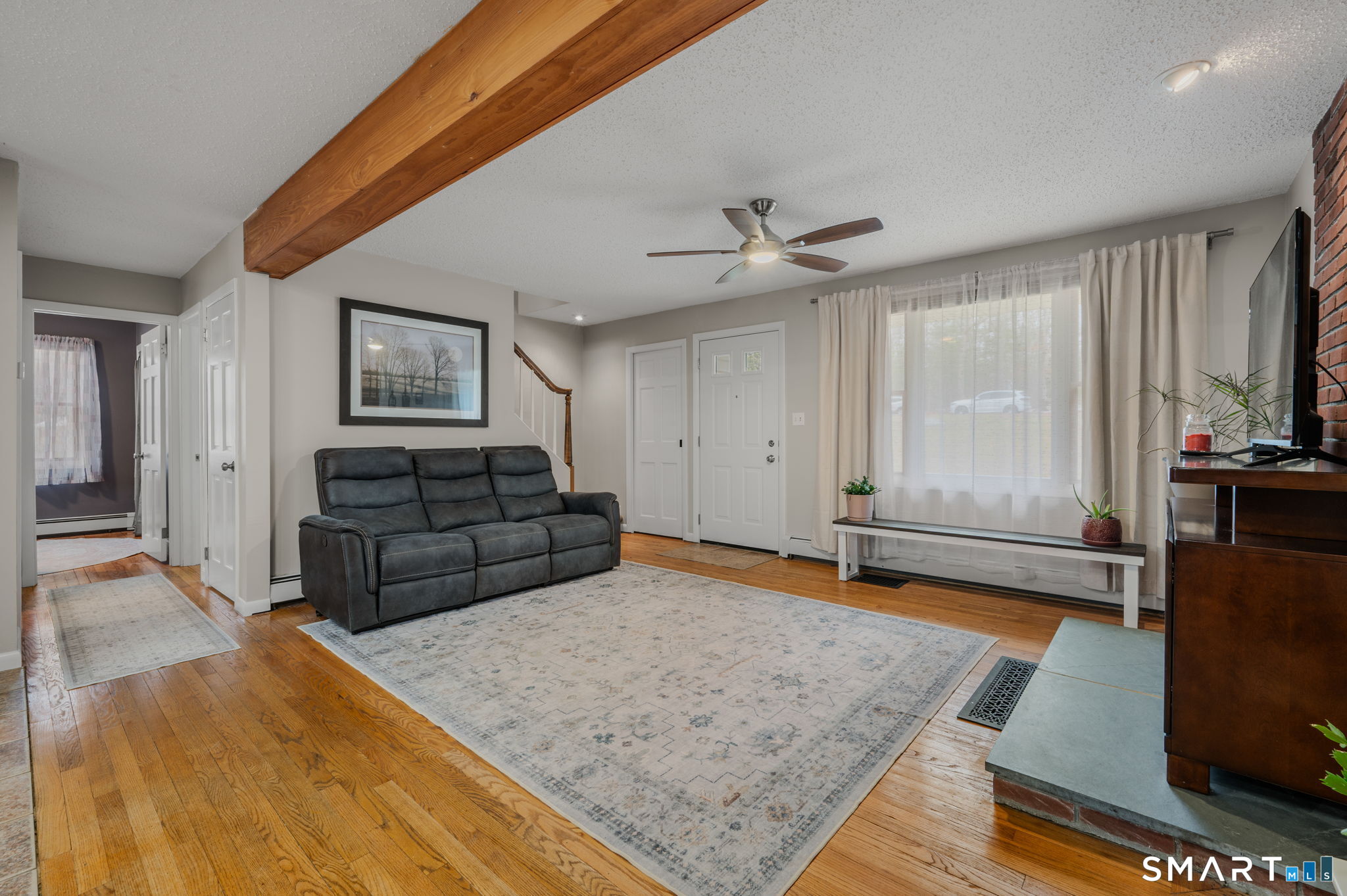 215 Haywardville Road East Haddam, CT 06415 - Photo 7 of 31 a living room with furniture and a rug