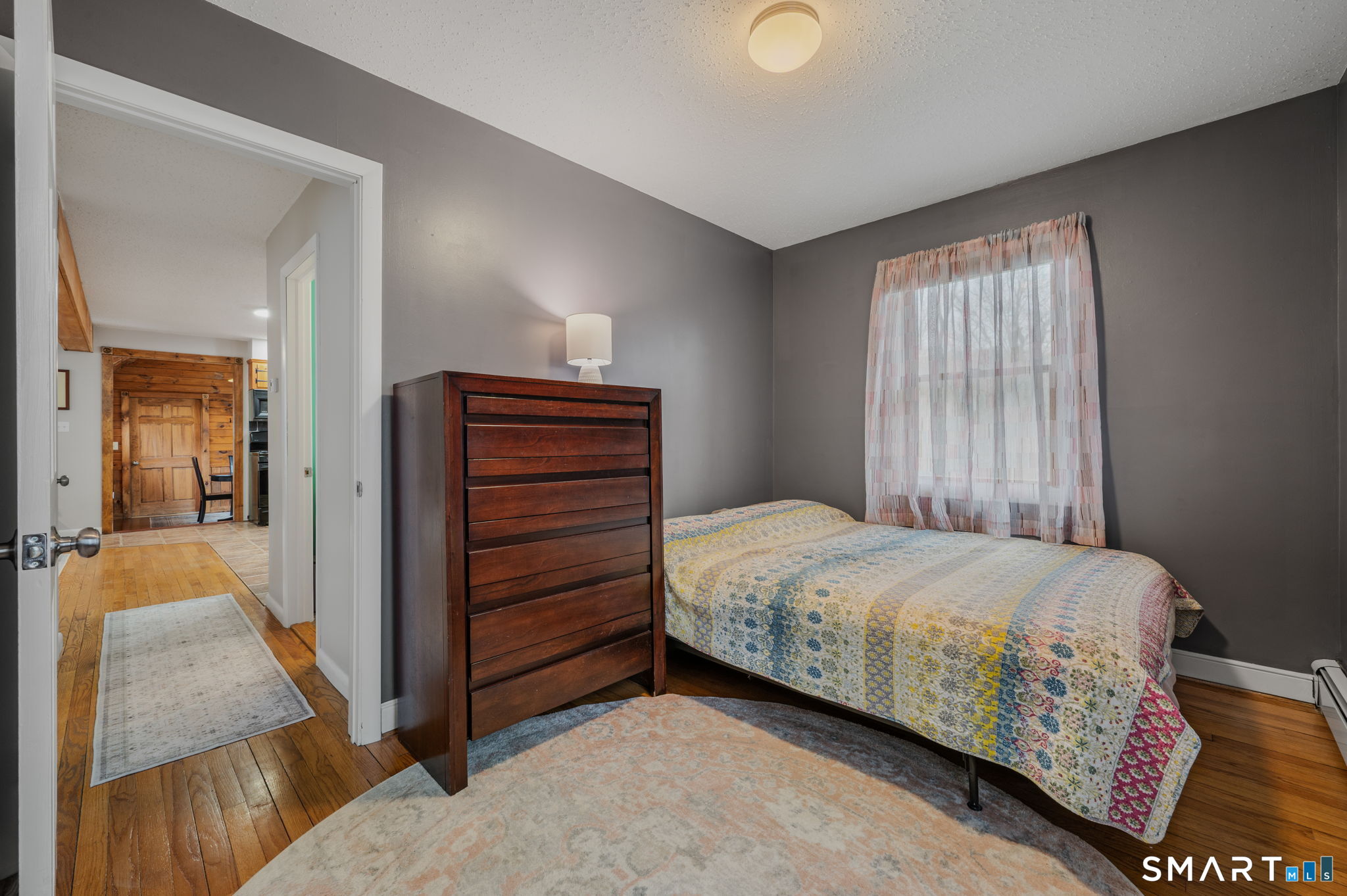 215 Haywardville Road East Haddam, CT 06415 - Photo 10 of 31 a bedroom with a bed and a dresser