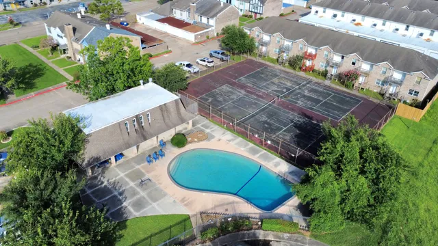 an aerial view of a house with a swimming pool