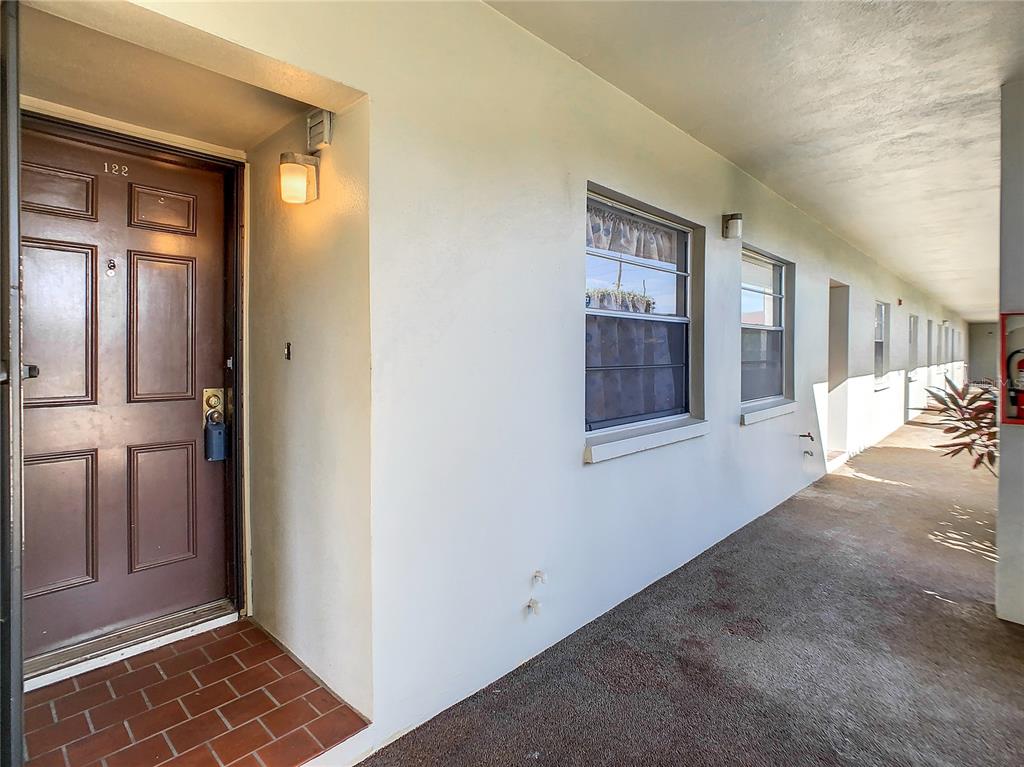 5197 Silent Loop, Unit 122 New Port Richey, FL 34652 - Photo 1 of 1 Unit 122 right by carport