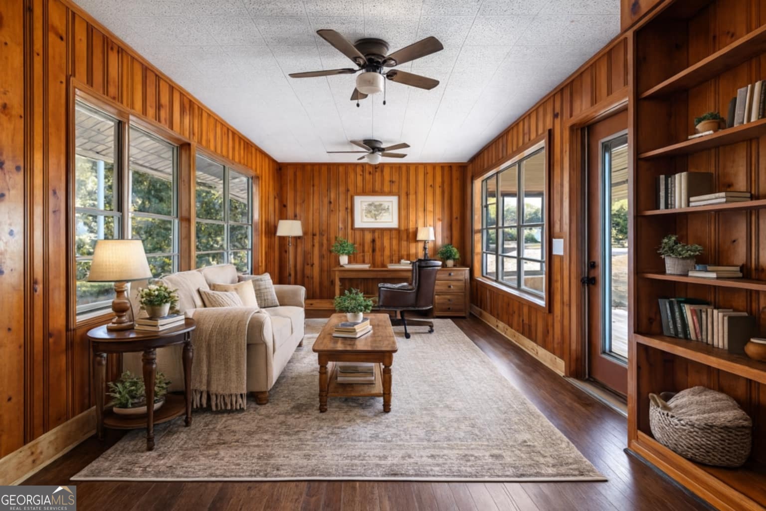 213 N Street Southwest Thomaston, GA 30286 - Photo 14 of 38 a living room with furniture a bookshelf and a large window
