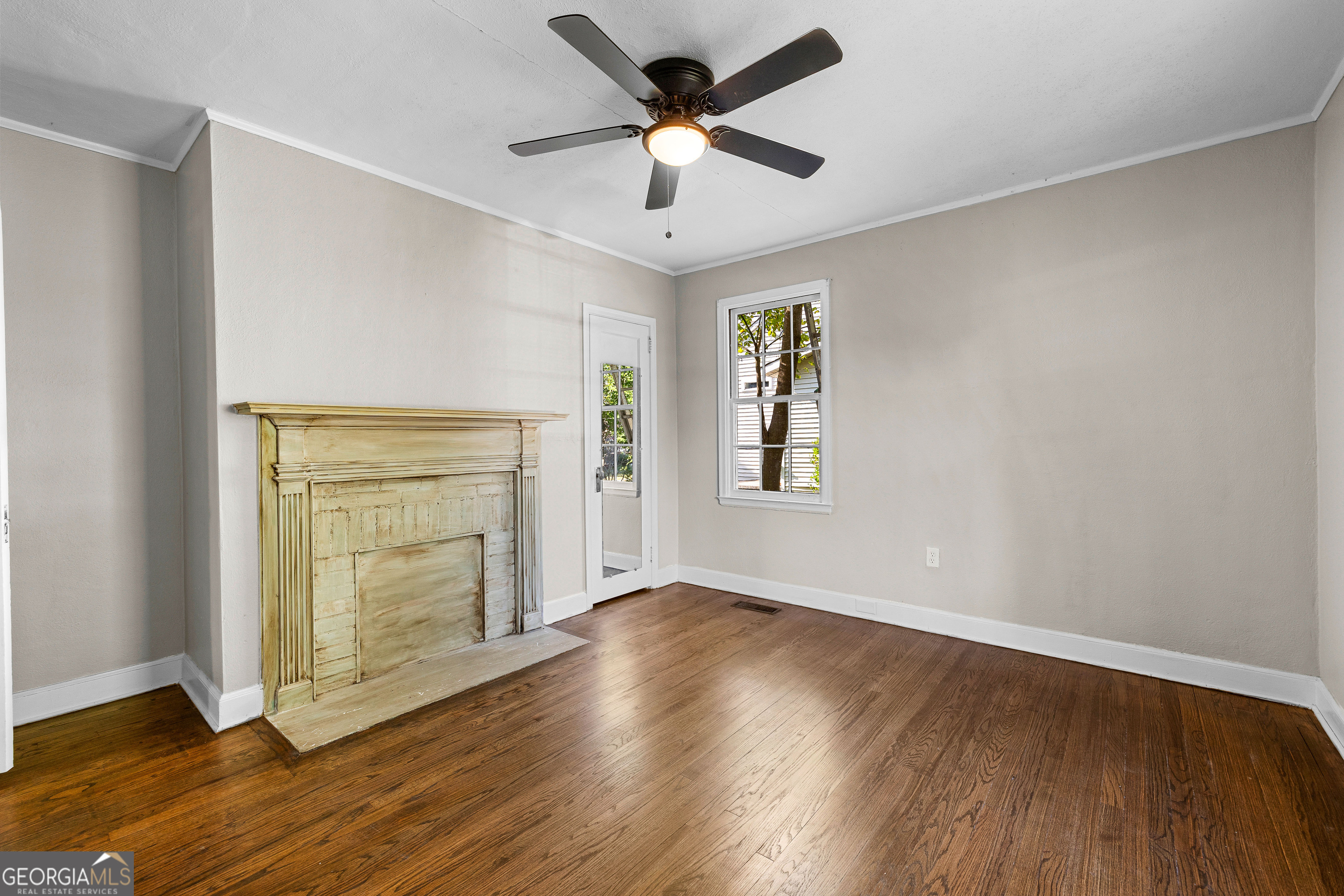213 N Street Southwest Thomaston, GA 30286 - Photo 24 of 38 a view of an empty room with wooden floor and a window