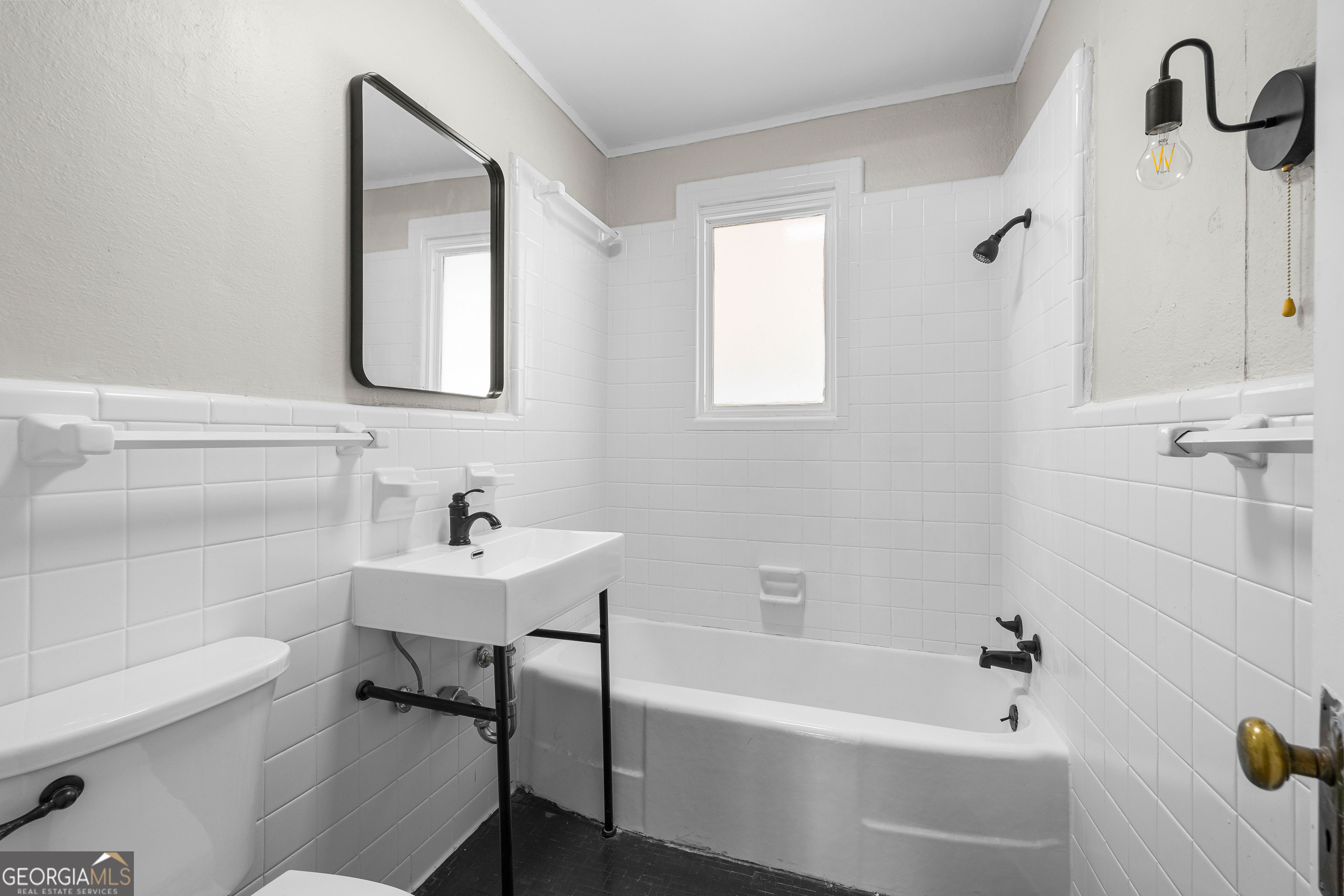 213 N Street Southwest Thomaston, GA 30286 - Photo 27 of 38 a bathroom with a sink a toilet and shower