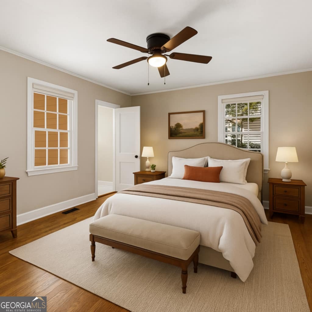 213 N Street Southwest Thomaston, GA 30286 - Photo 29 of 38 a bedroom with a bed and wooden floor