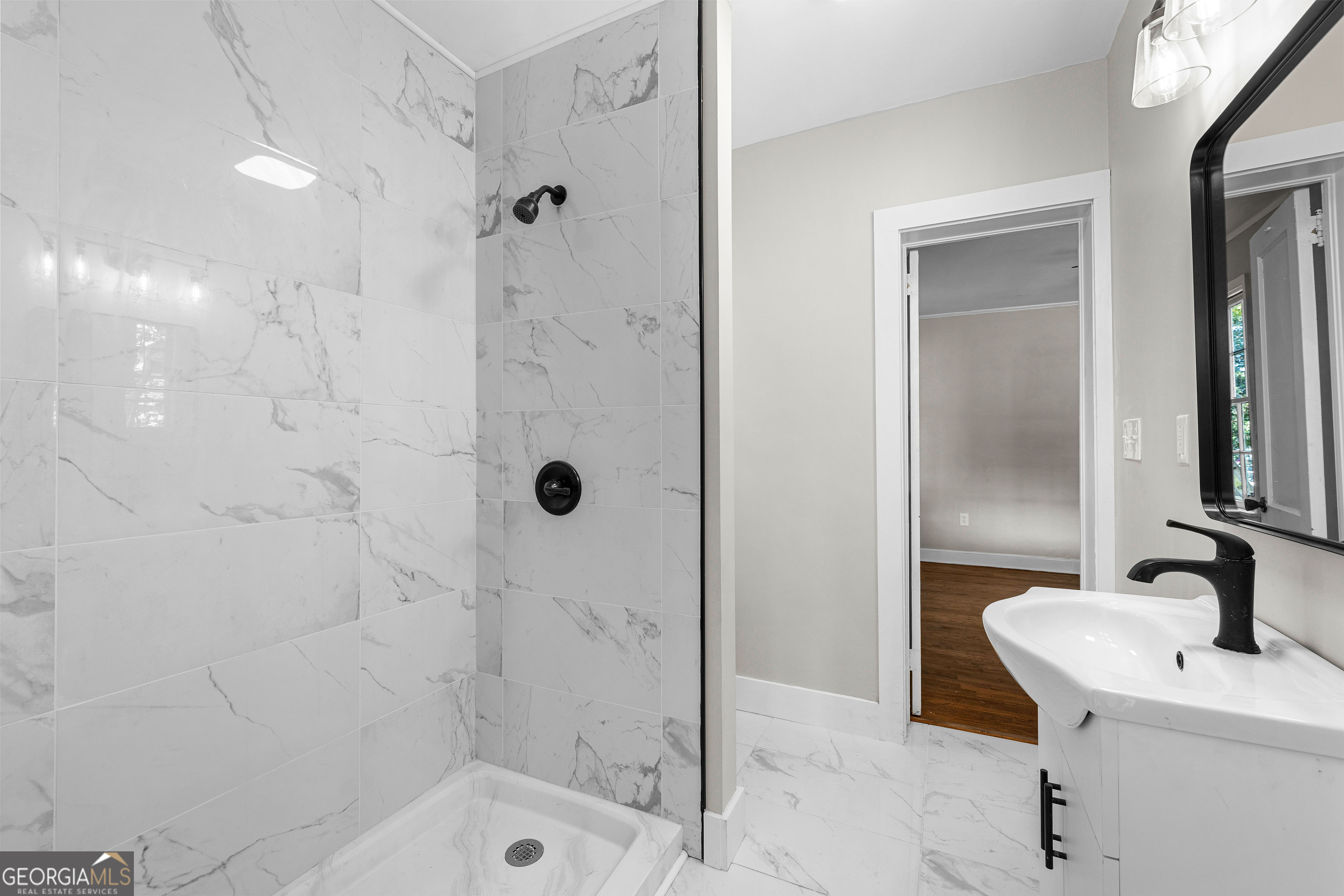 213 N Street Southwest Thomaston, GA 30286 - Photo 32 of 38 a bathroom with a sink shower and a mirror