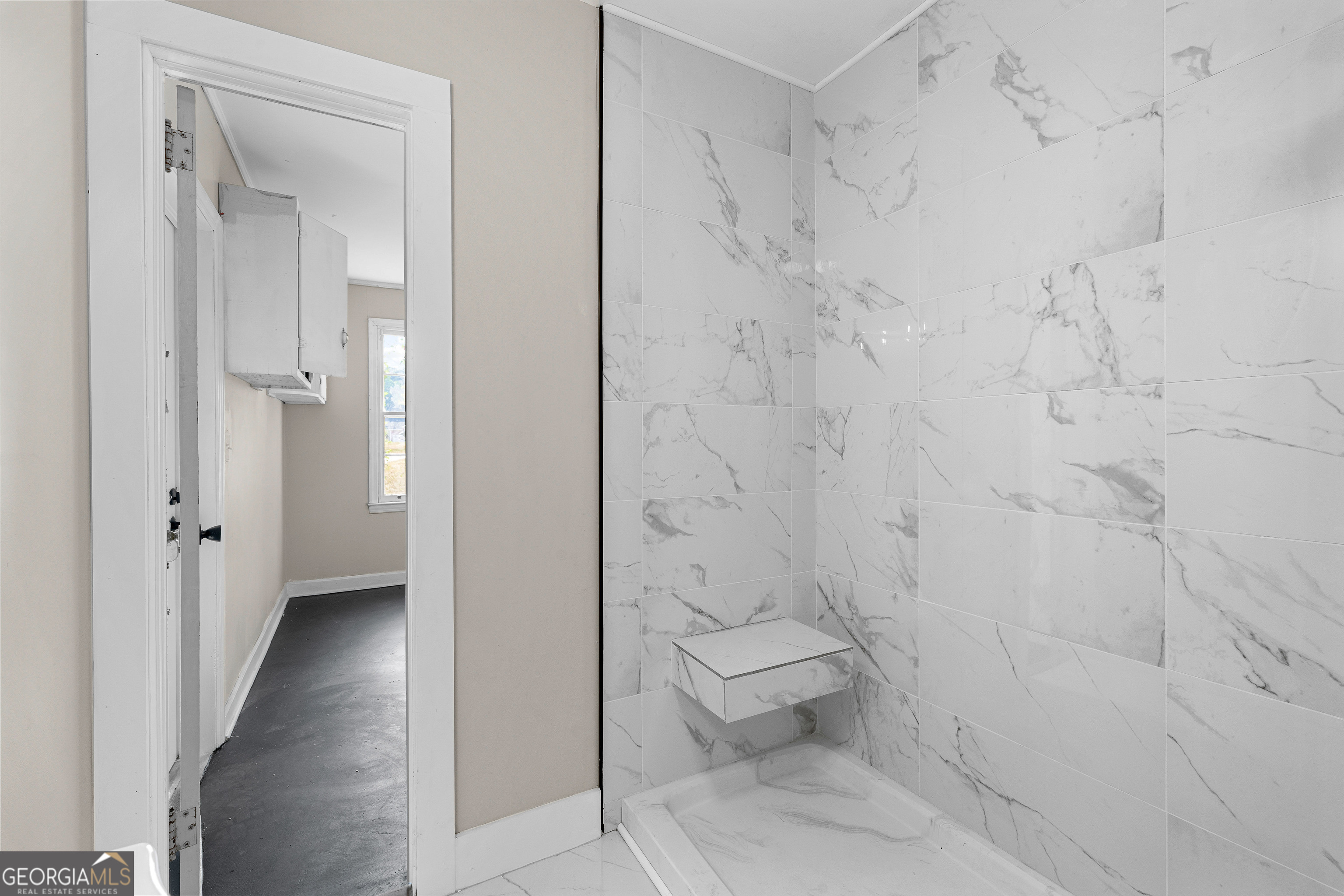 213 N Street Southwest Thomaston, GA 30286 - Photo 33 of 38 a bathroom with a white toilet and a shower