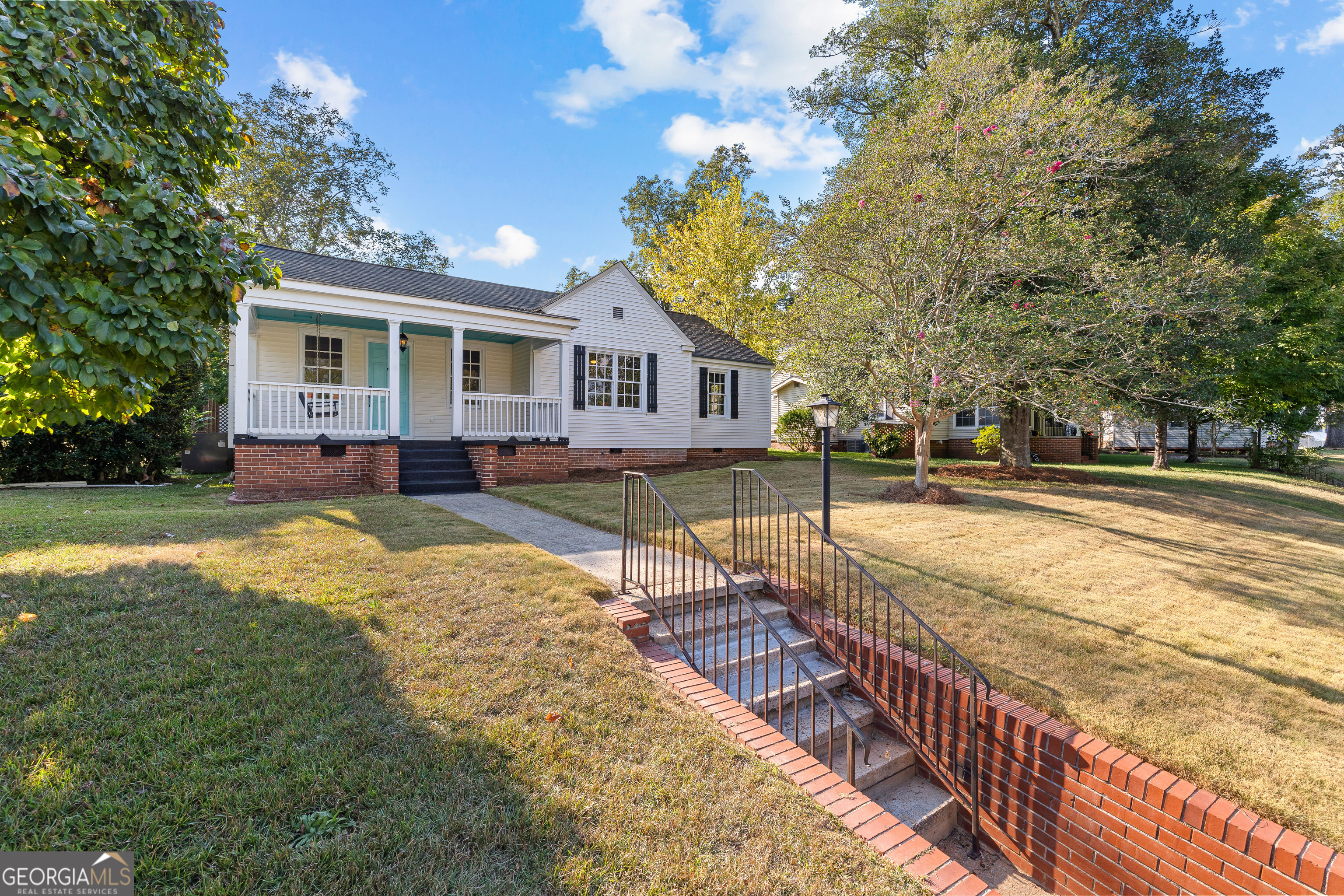 213 N Street Southwest Thomaston, GA 30286 - Photo 4 of 38 a view of a house with backyard and trees