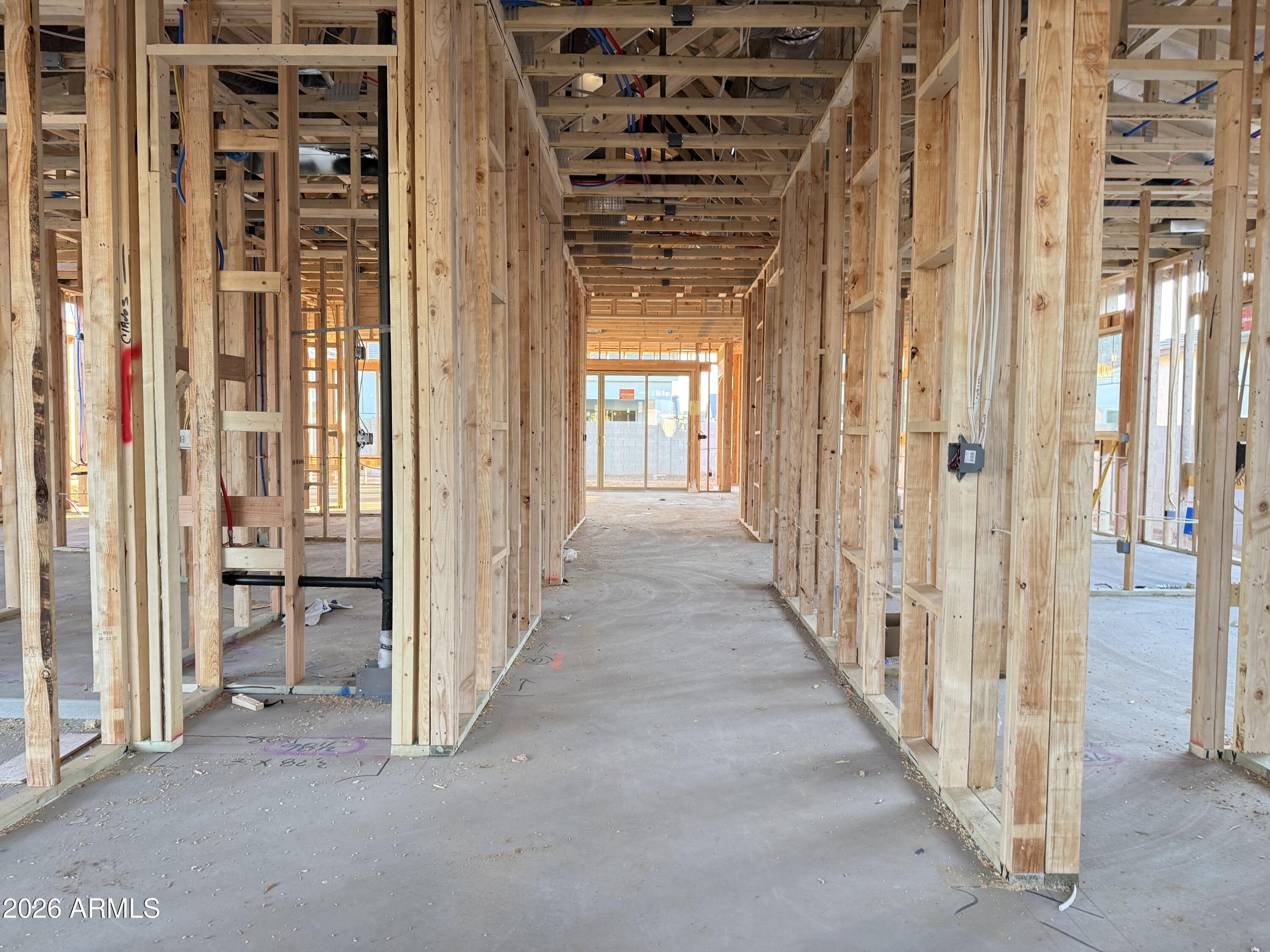 22721 East Stirrup Street Queen Creek, AZ 85142 - Photo 2 of 20 a view of a hallway with wooden floor and entryway