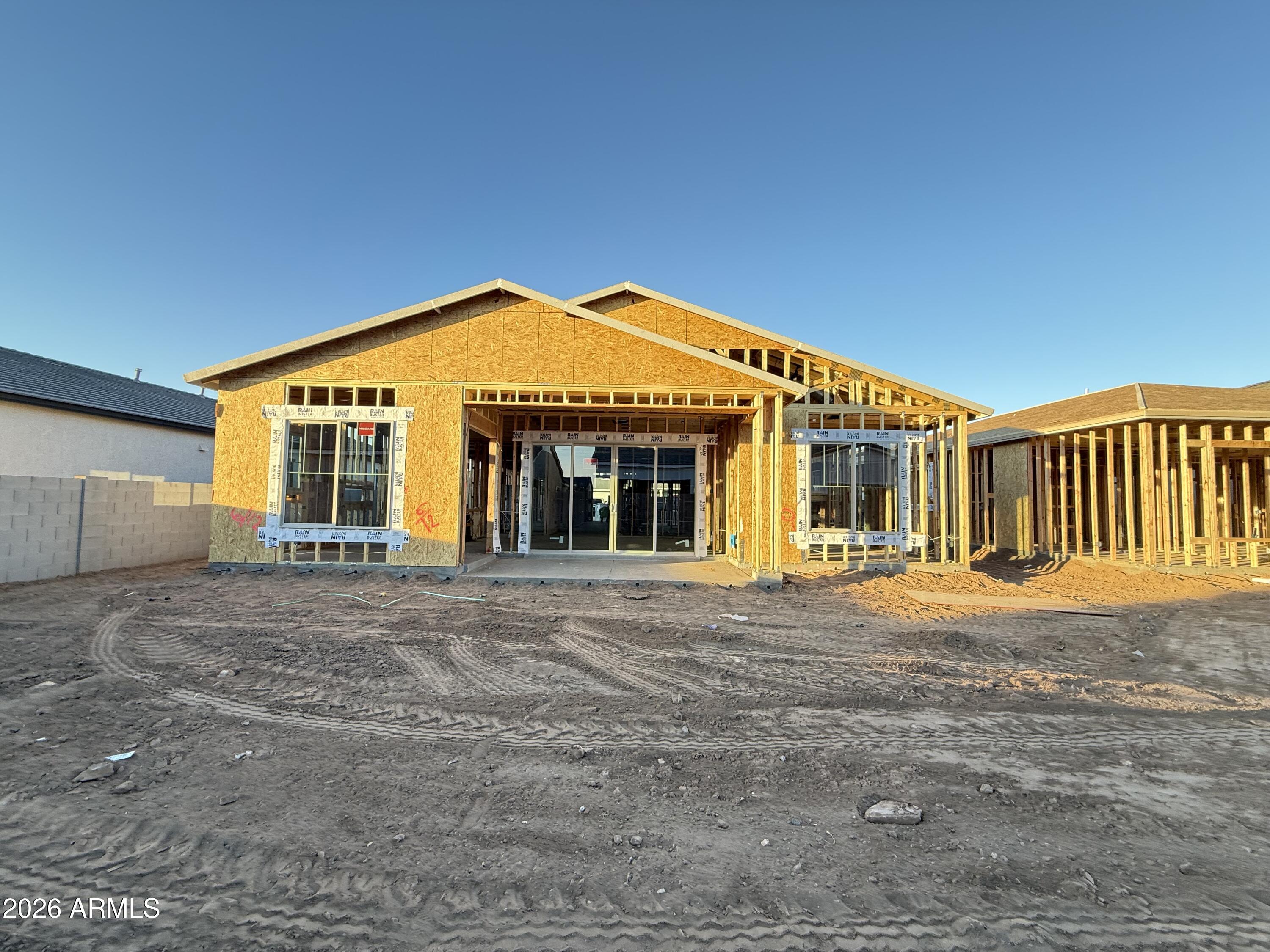 22721 East Stirrup Street Queen Creek, AZ 85142 - Photo 6 of 20 a front view of a house with a yard